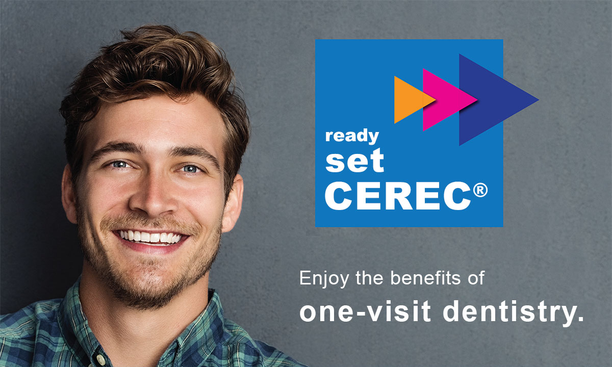 A man with a beard smiling at the camera, holding a toothbrush, standing against a blue background with a logo for Cerec and text that reads READY SET CEREC .